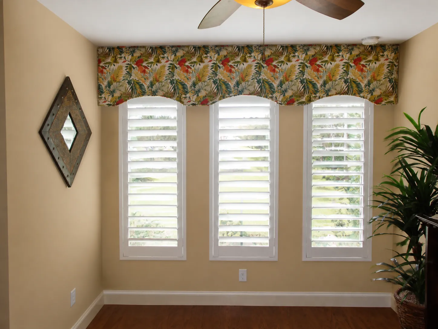 Three custom white plantation shutters fitted to narrow windows in a Ponte Vedra home