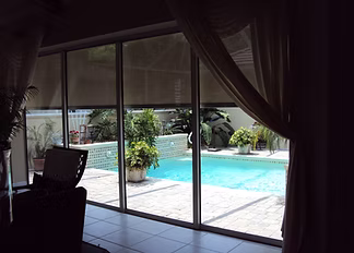 Motorized roll screen for a Ponte Vedra lanai