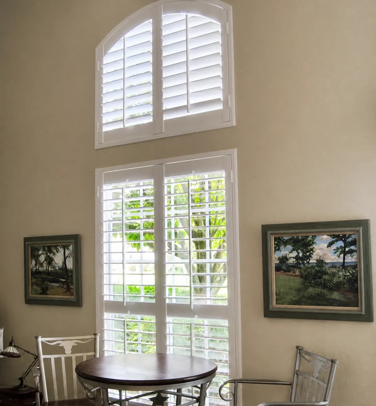 Plantation shutters on stacked dining room windows